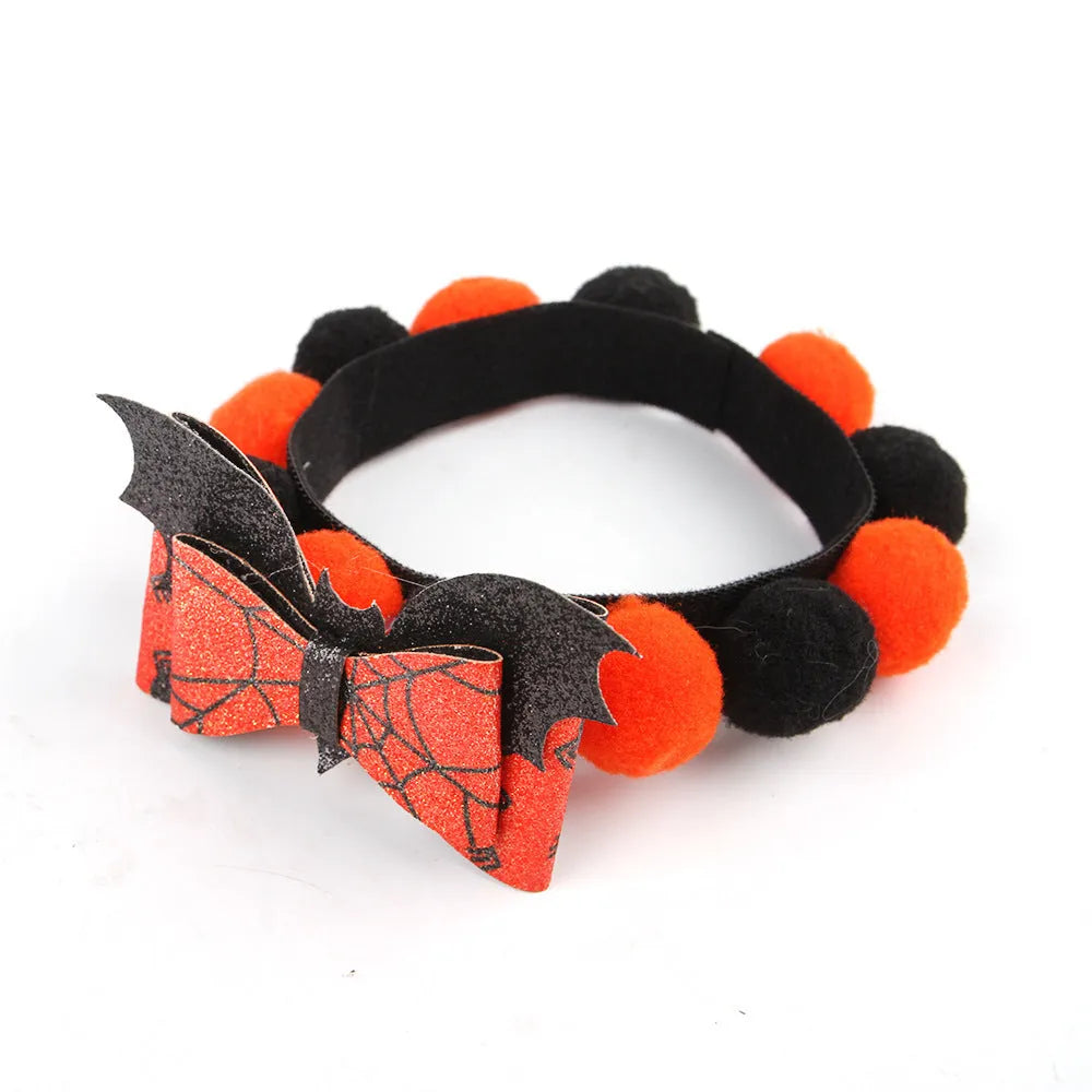 Halloween pet collar with decorative fur ball in pumpkin, bow, skull, and witch designs