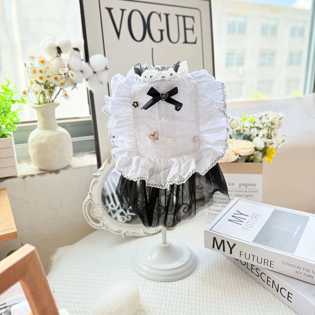 White polyester princess style gauze skirt for a small dog on a hanger, showing the layered skirt design.