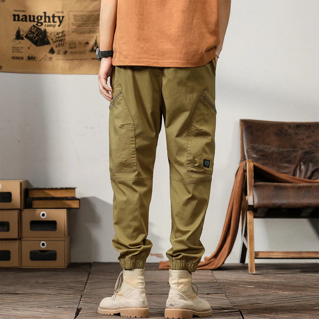 Men's American retro style tapered harem pants with ankle banded leg opening in cotton fabric