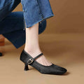 Women's black square toe stiletto ankle-strap heels with horse hair upper and buckle closure.