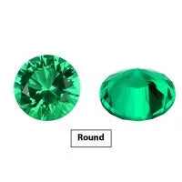 A selection of polished Columbia green cultivated emerald gemstones in various cuts and sizes on a white background.