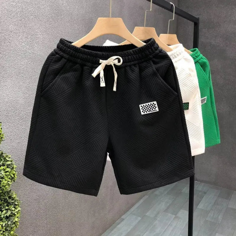 Micro-elastic polyester sports shorts in white, black and green colours for beach and casual wear