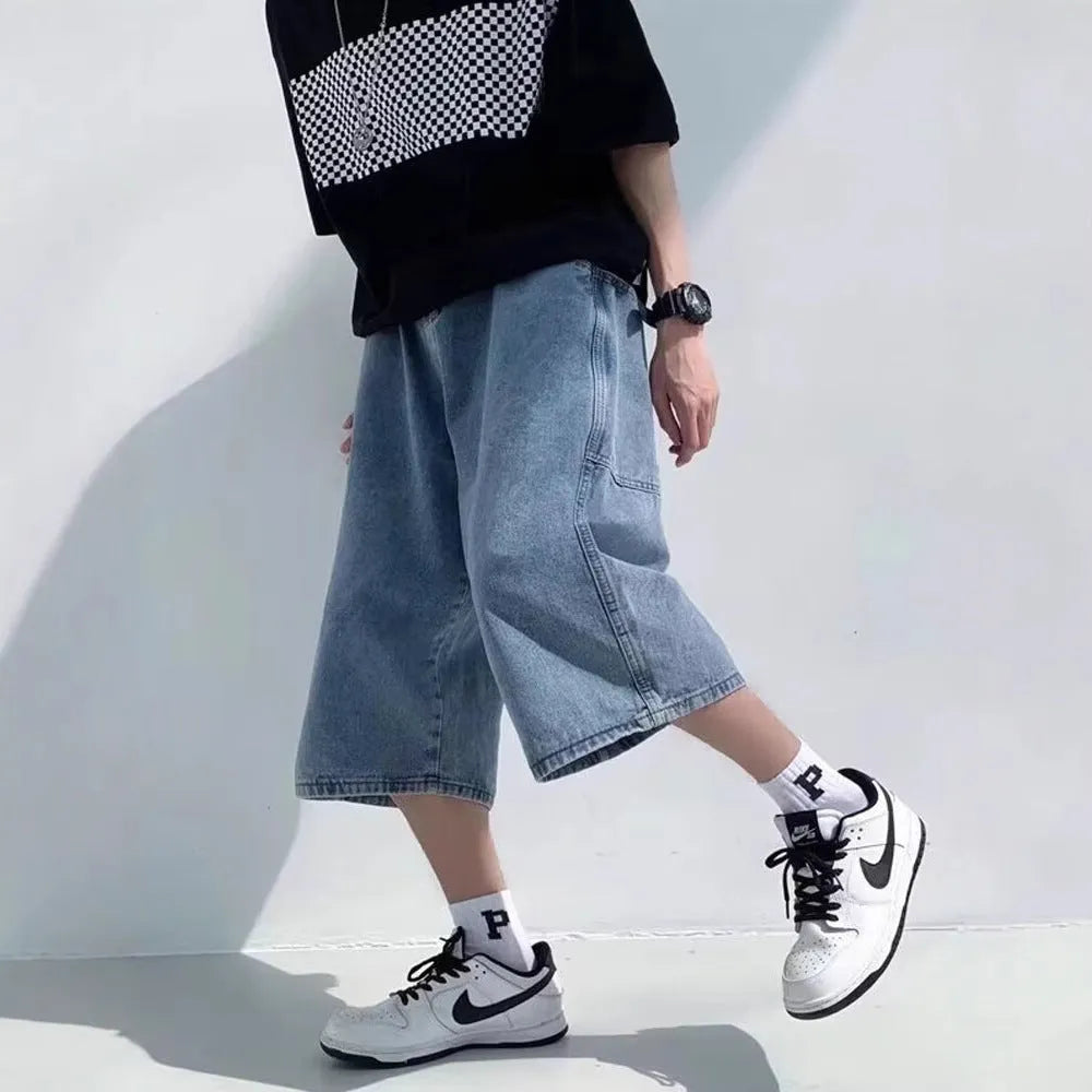 Man's washed light blue denim shorts with a high waist, cropped length, and straight legs.