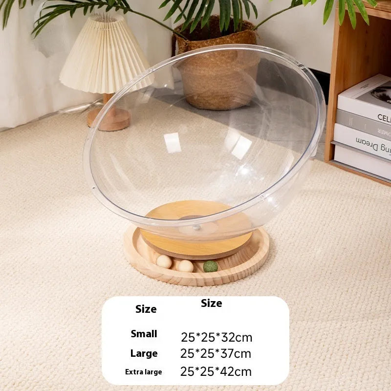 Transparent acrylic cat space capsule bed with turntable base on wooden floor