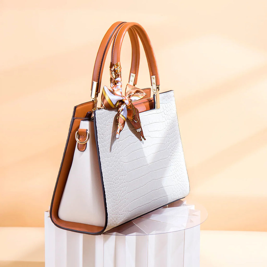 Milky white women's shoulder handbag showing slit pocket and multiple interior compartments