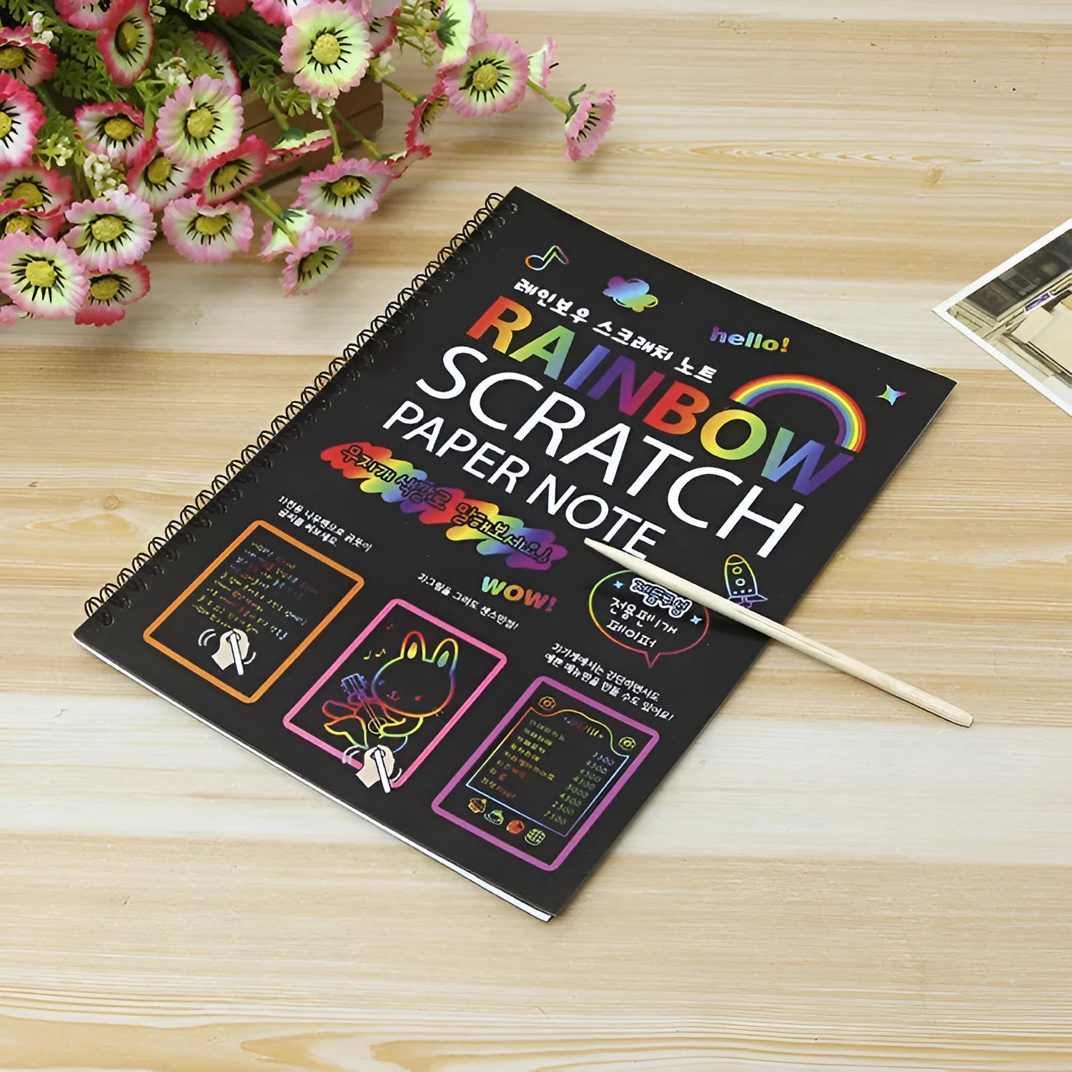 Children's large scratch art paper with scraper tool revealing colourful puzzle design