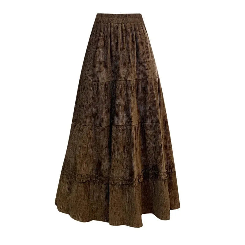 Beige corduroy A-line midi skirt with an elastic waistband on a hanger.