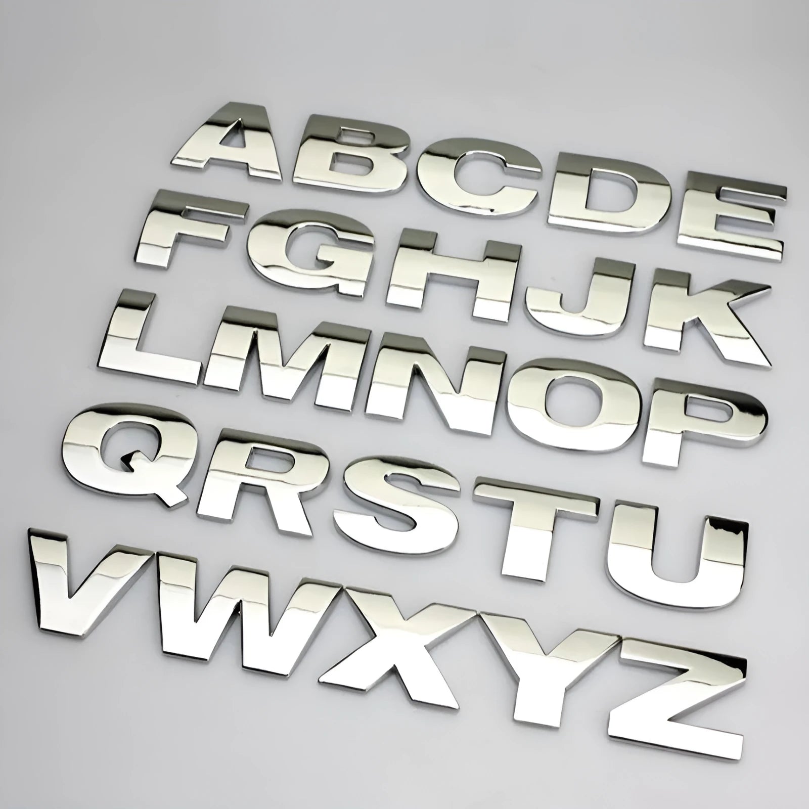 Silver and black metal zinc alloy 3D car bumper stickers showing letters A to Y, 2.5cm size