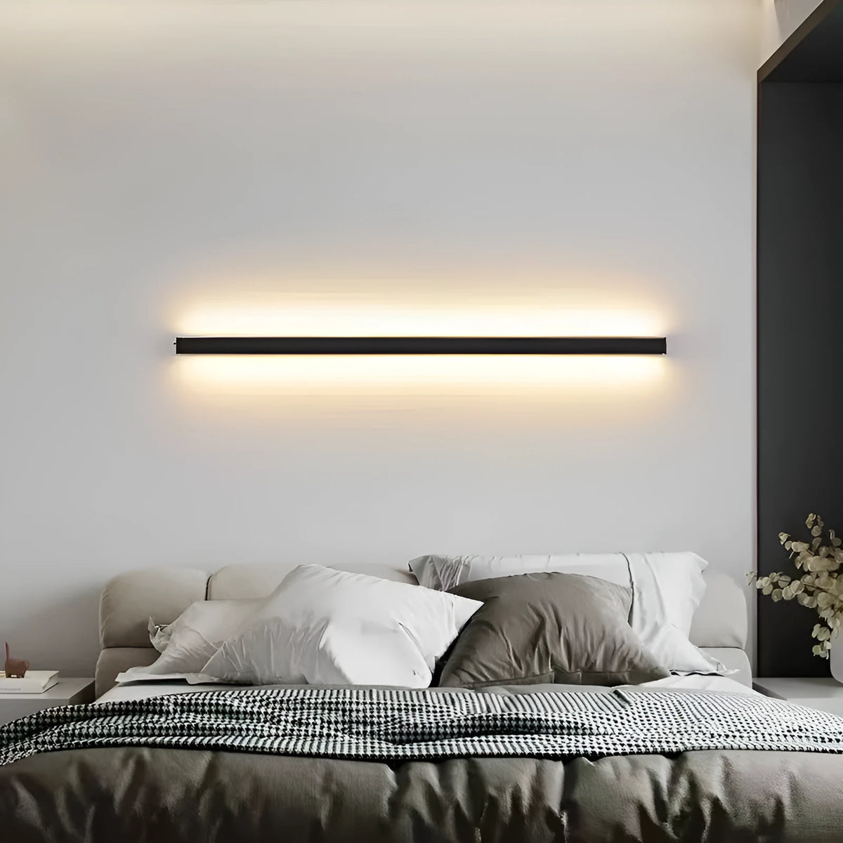 Black 80cm long aluminium LED strip wall lamp mounted on a wall, demonstrating three colour light options.