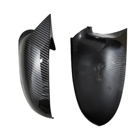 Pair of plastic mirror housings for Volkswagen Old Sagitar in black and carbon fibre finishes.