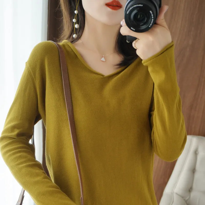 Women's V-neck long sleeve knit top in a macaron colour on a hanger.