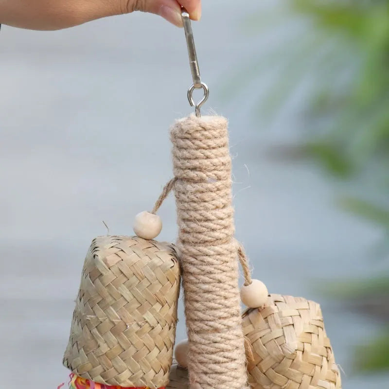 Parrot toy with wood and sisal construction containing colourful shredded paper, 15cm by 35cm