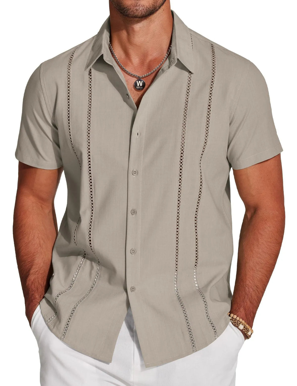 Man wearing a slim fit, short sleeve Hawaiian shirt with a colourful digital print pattern.