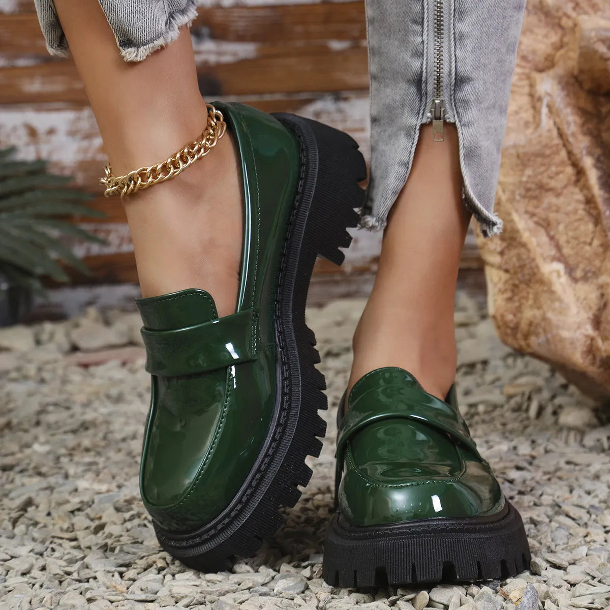 Plus size women's black slip-on loafers with a chunky platform heel and rubber sole