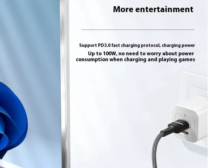 11-in-1 USB-C expansion hub with attached cable and Gigabit Ethernet port on a desk.
