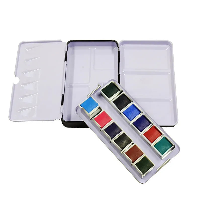 Tinplate metal watercolour paint box with folding compartments for solid pigment storage