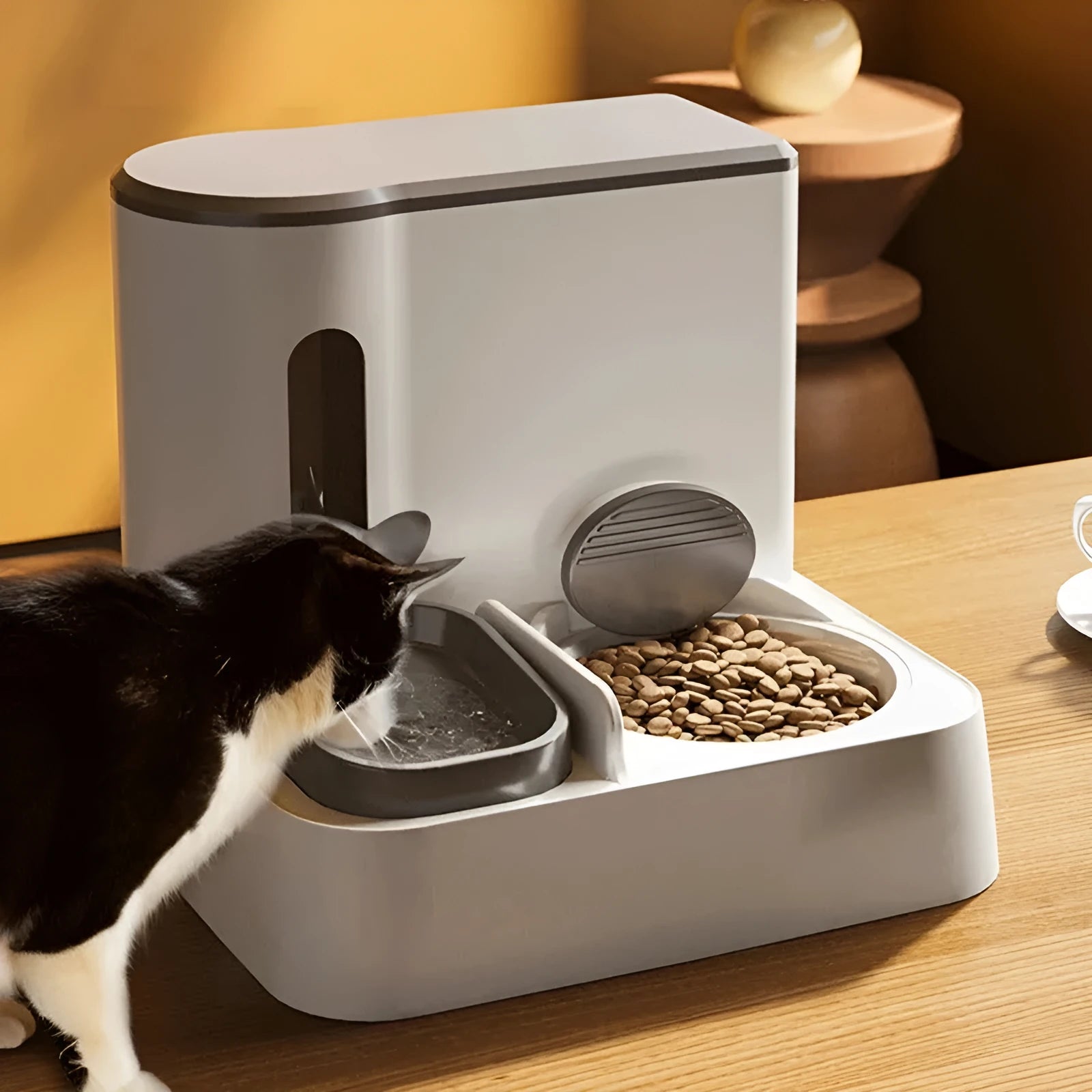 Grey automatic cat feeder and water dispenser station with integrated double bowls