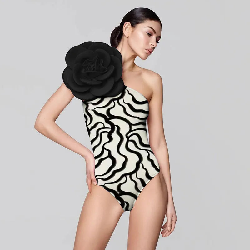 One-piece floral swimsuit in a solid colour with a skirt option on a mannequin.