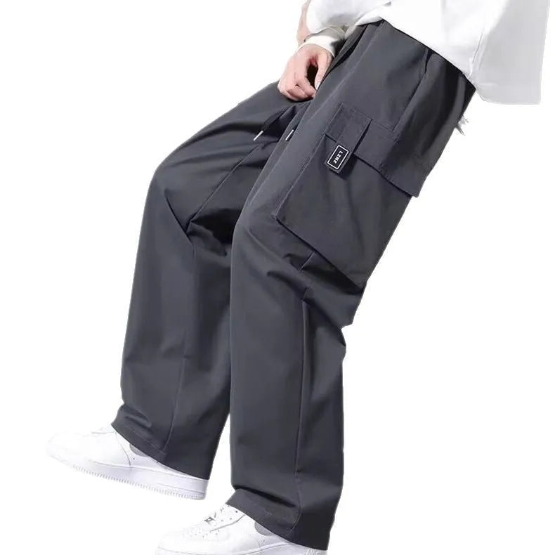 Boys cargo pants with drawstring waist and large side pockets in polyester fabric