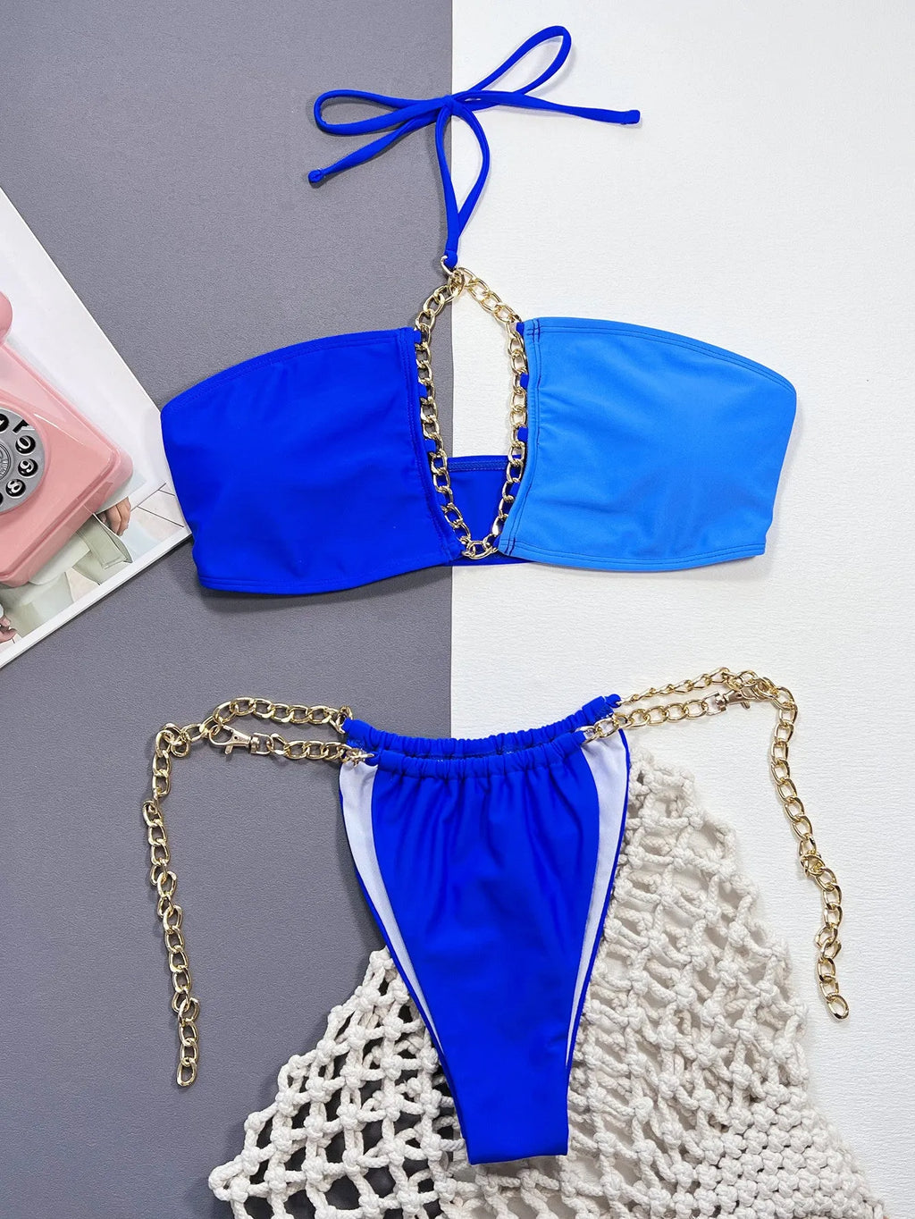Blue solid colour women's bikini swimsuit with split style design on mannequin