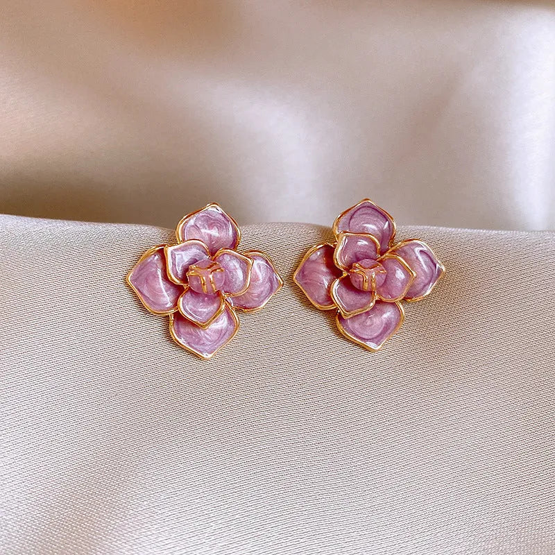 Gold plated purple floral stud earrings with oil-spot glaze colour variation on copper