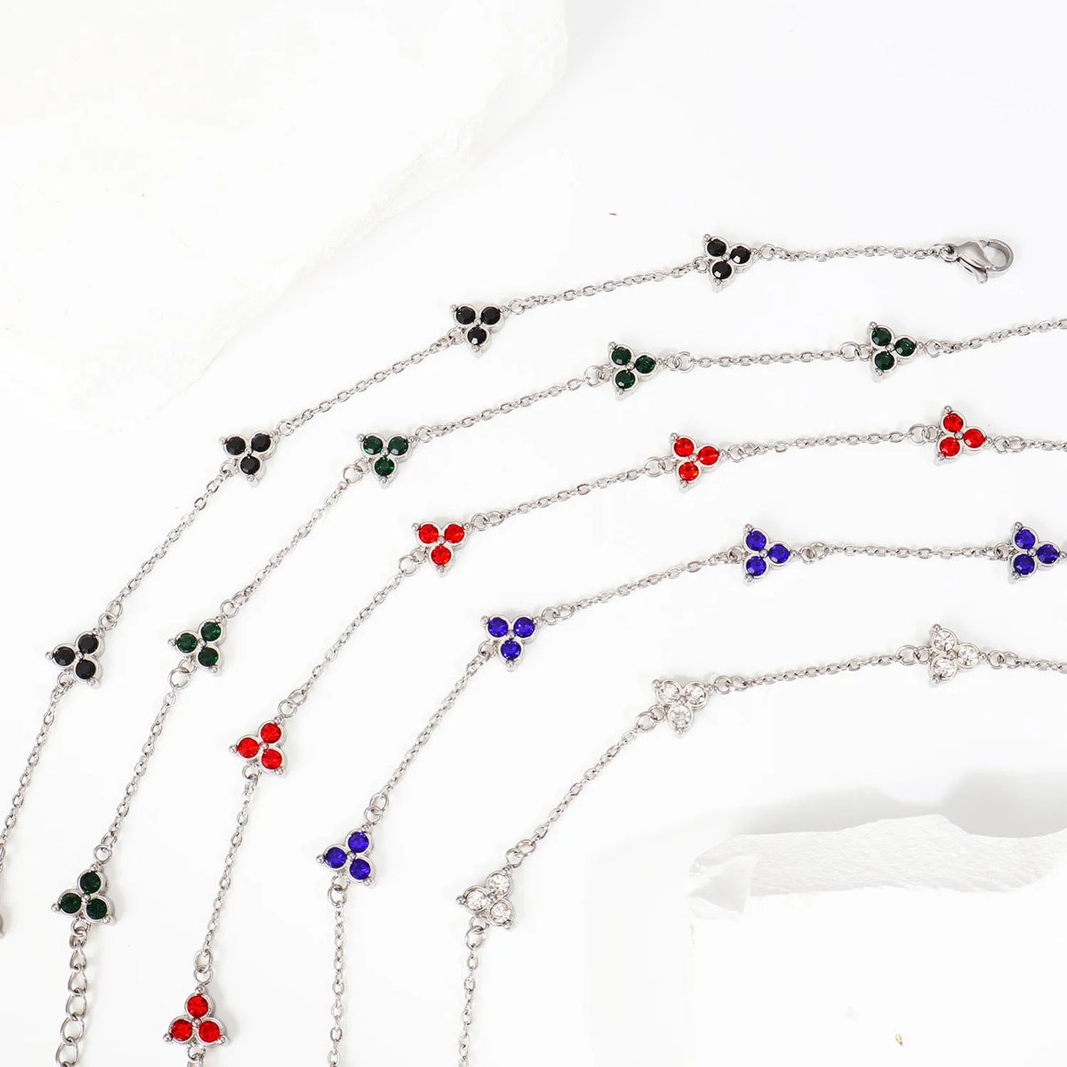 Women's geometric stainless steel bracelet with three-diamond triangle design and zircon stones