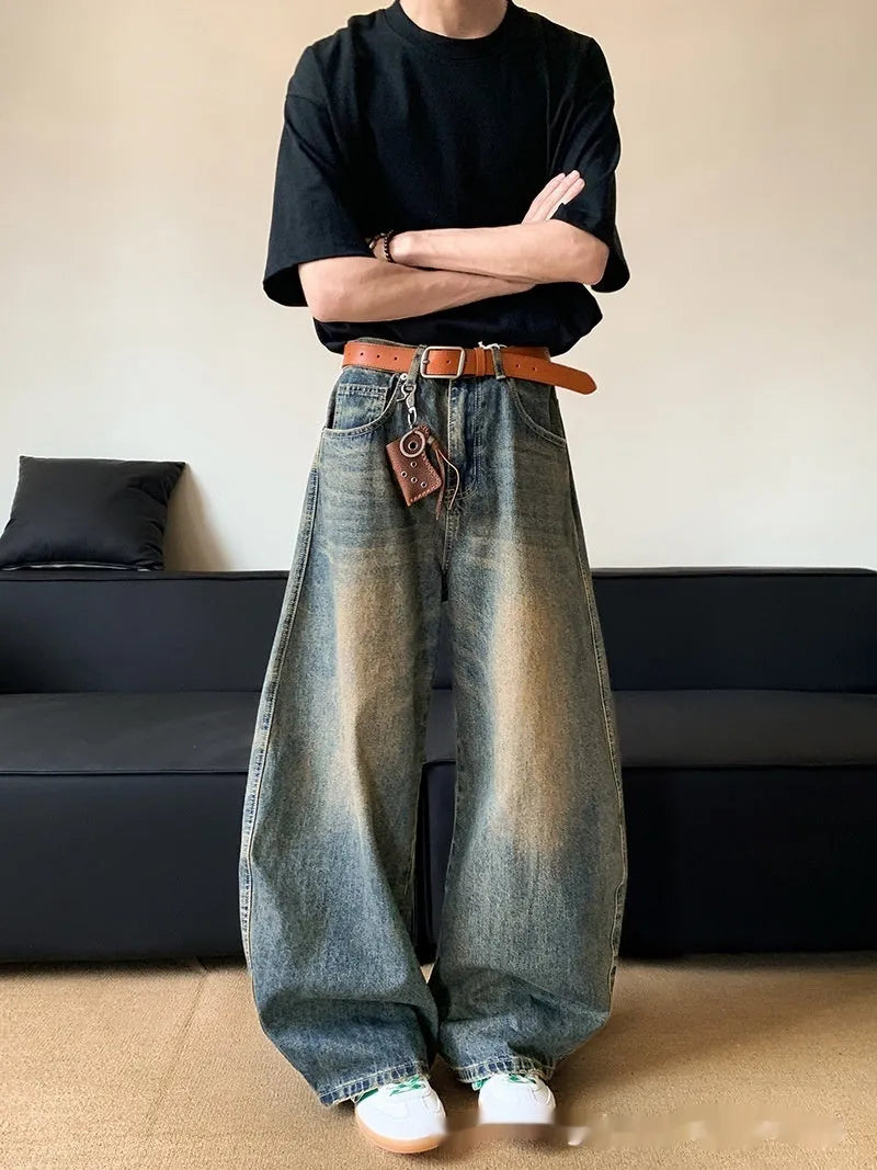 Men's retro blue distressed denim jeans with wide-leg trouser design and micro-elastic fabric