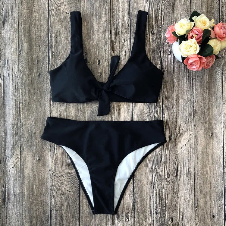 Women's solid colour bikini swimsuit set in polyester fabric, shown in black, pink, red, white, or wine red.
