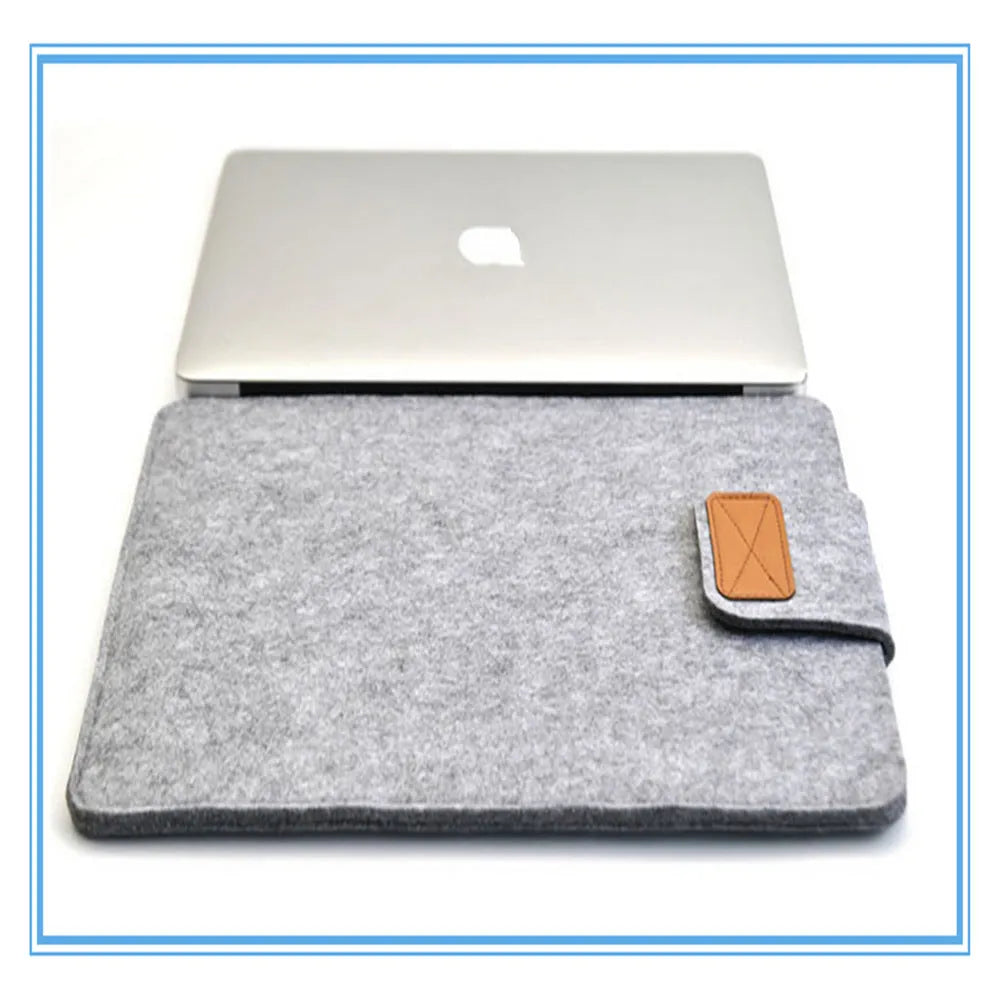 Dark grey felt clamshell laptop bag open to show internal compartment for a tablet