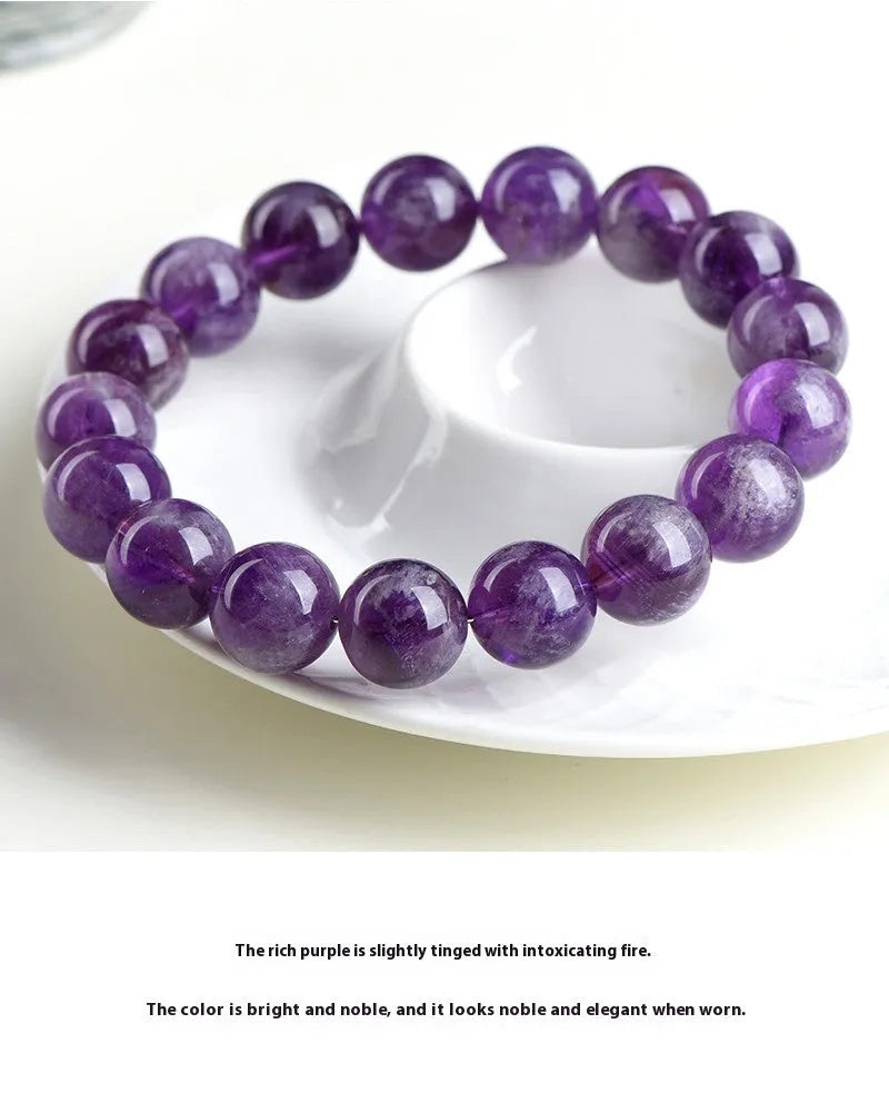 Natural feather amethyst crystal bracelet with Snow Mountain purple scattered beads and a Ruyi geometry design.