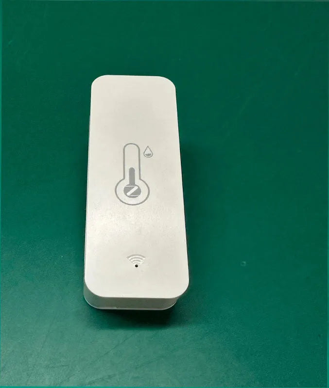 White ABS plastic WiFi temperature and humidity sensor measuring 72x25x20mm for smart home monitoring