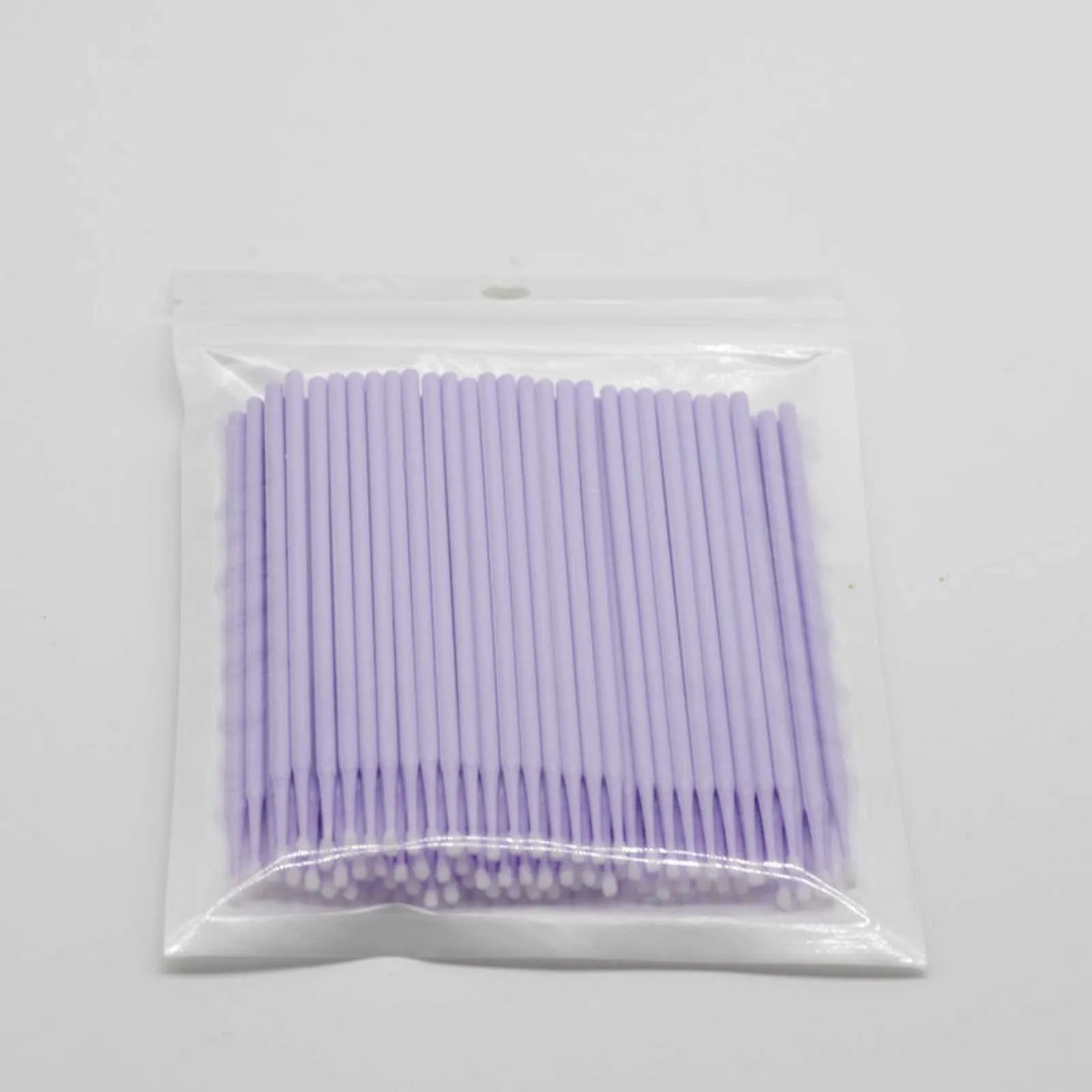 Disposable micro applicator brushes with bendable cotton tips and colour-coded handles for eyelash extensions