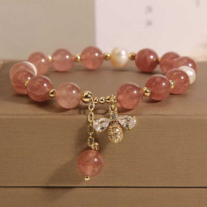 Women's bracelet with freshwater pearls and strawberry quartz stones with zircon accents on alloy hardware