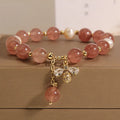 Women's bracelet with freshwater pearls and strawberry quartz stones with zircon accents on alloy hardware