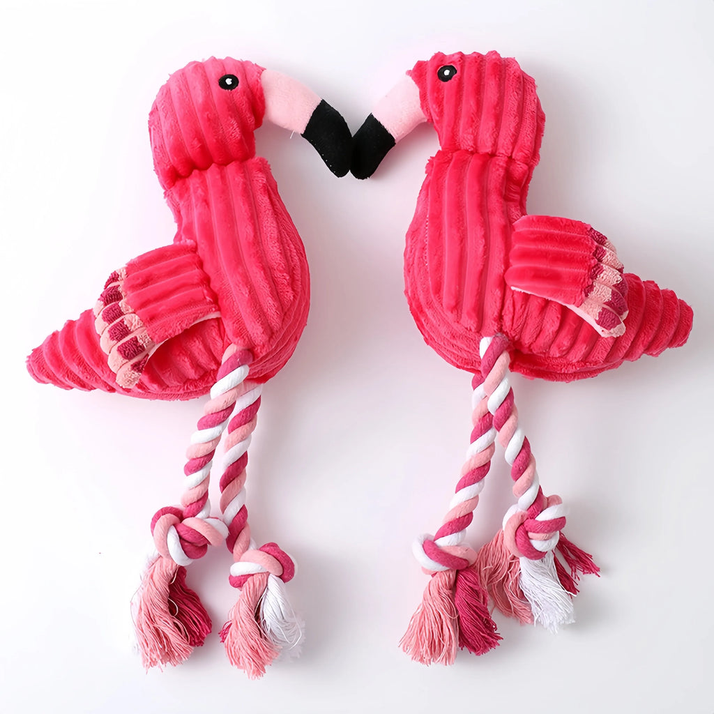 Pink animal-shaped corduroy dog toy with a squeaker inside on a white background.