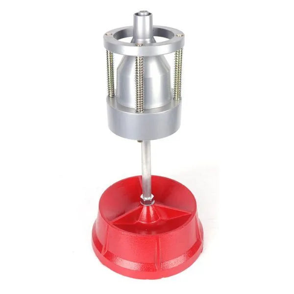 Portable aluminium hub balancer for car and truck tyres with 1.5 to 4 inch hub range on enamel-finished base.