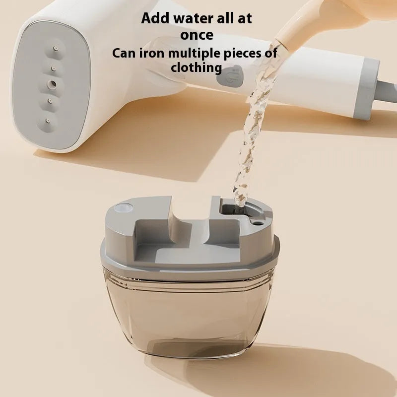 Blue and white handheld garment steamer with hanging iron attachment on wooden surface
