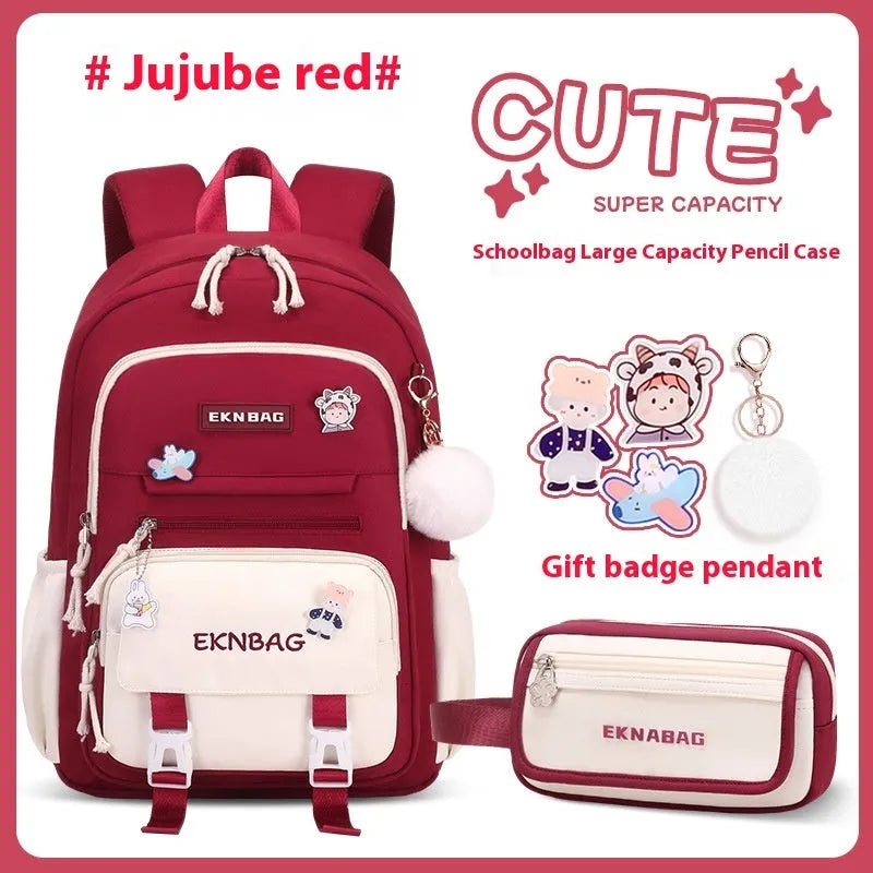Girls waterproof Oxford cloth school backpack with curved shoulder straps and spine protection in solid colour options.