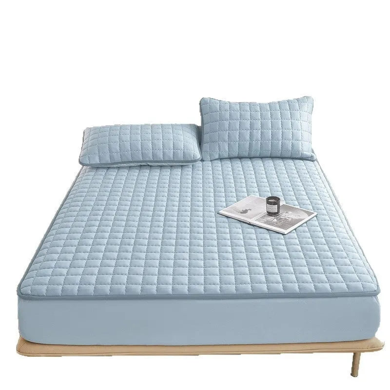 Class A waterproof washed cotton fitted sheet in light grey colour on a bed.
