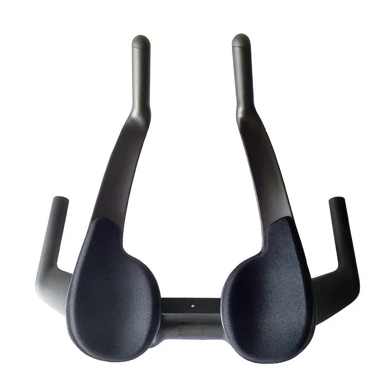 Black carbon fibre time trial bicycle handlebar showing aero extensions and central clamp area.