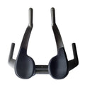 Black carbon fibre time trial bicycle handlebar showing aero extensions and central clamp area.