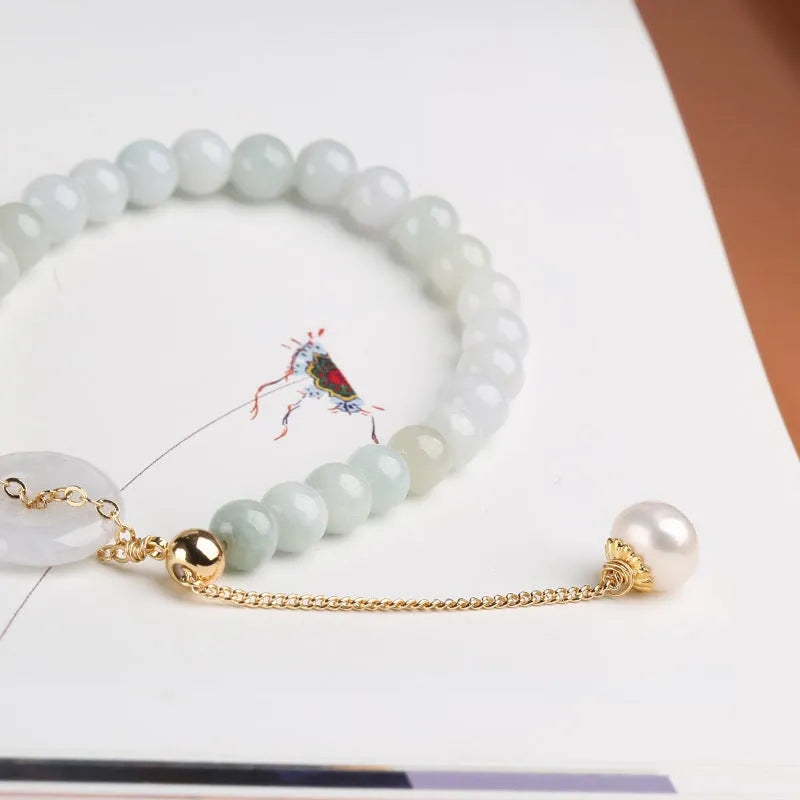 Women's natural emerald peace buckle pearl bracelet with geometric jade pendant on wrist