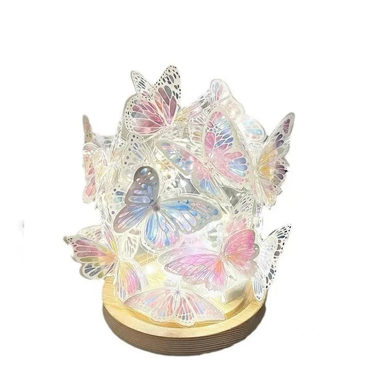 Butterfly night lamp with glass shade on raw wood base, showing 12x15cm size.