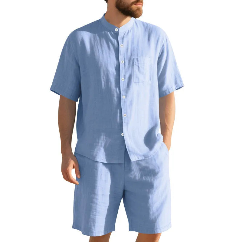 Men's light blue linen two-piece suit with short sleeve jacket and shorts on a hanger.