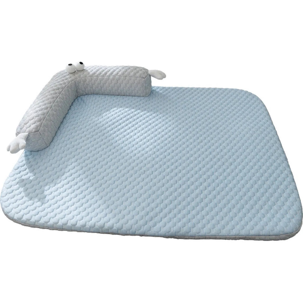 Blue pet bed cushion with big-eyed monster design for dogs and cats on a wooden floor.