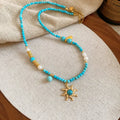 Freshwater pearl necklace with geometric sun stone pendant on adjustable clavicle chain