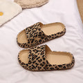 Women's leopard print slippers with thick EVA sole in black, pink, khaki, and white zebra print.