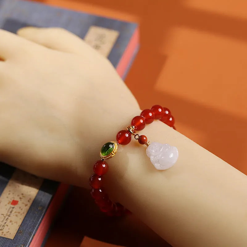 Handcrafted natural agate bracelet with red beads, amber geometric elements, and Maitreya Buddha charm