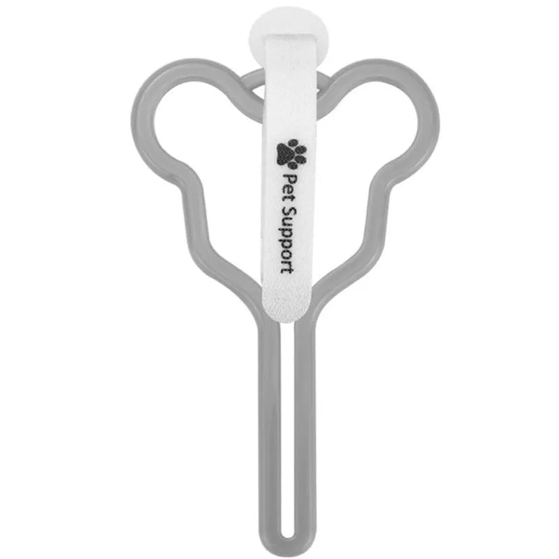 A hands-free dog poo bag holder with a fixed clip and adjustable Velcro strap attached to a dog lead.