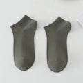 Solid colour low-cut polyester boat socks for men on a white background.